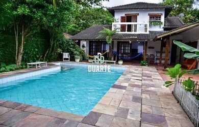 Imagem: A casa possui 5 Dormitórios, 5 Banheiros, 5 Vagas na garagem