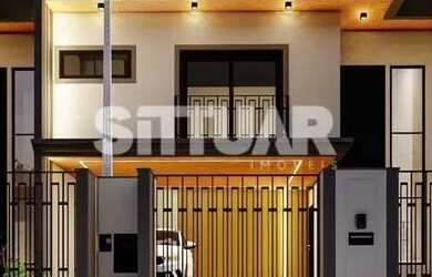 Imagem: A casa possui 3 Dormitórios, 2 Banheiros, 2 Vagas na garagem