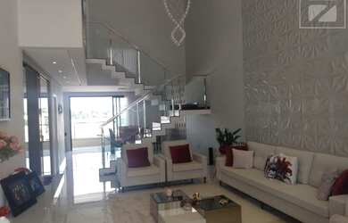 Imagem: A casa possui 3 Dormitórios, 5 Banheiros, 4 Vagas na garagem