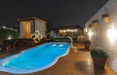 Imagem: A casa possui 4 Dormitórios, 5 Banheiros, 4 Vagas na garagem