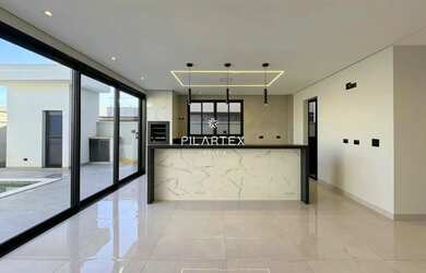 Imagem: A casa possui 3 Dormitórios, 5 Banheiros, 4 Vagas na garagem