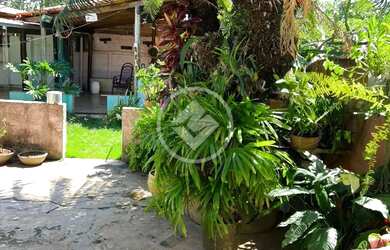 Imagem: A casa possui 4 Dormitórios, 3 Banheiros, 360m² de Área e