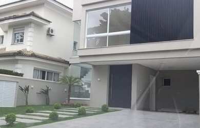 Imagem: A casa em condomínio possui 1 Dormitório, 5 Banheiros, 4 Vagas