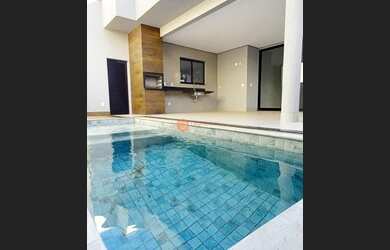 Imagem: A casa possui 4 Dormitórios, 5 Banheiros, 4 Vagas na garagem