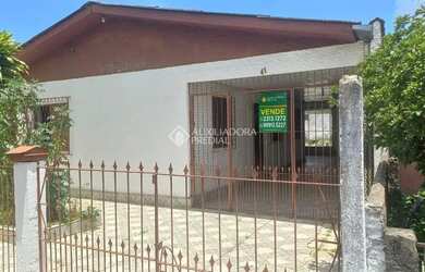 Imagem: A casa possui 3 Dormitórios, 2 Banheiros, 130m² de Área e