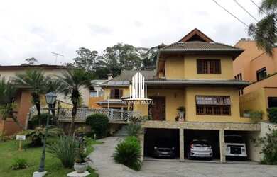 Imagem: A casa possui 4 Dormitórios, 5 Banheiros, 5 Vagas na garagem