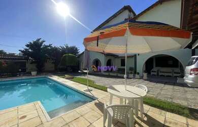 Imagem: A casa possui 5 Dormitórios, 5 Banheiros, 4 Vagas na garagem