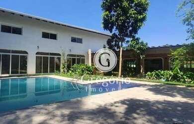 Imagem: A casa possui 3 Dormitórios, 5 Banheiros, 5 Vagas na garagem