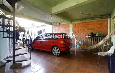 Imagem: A casa possui 3 Dormitórios, 2 Banheiros, 1 Vaga na garagem