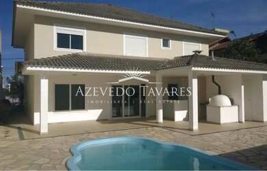 Imagem: A casa possui 2 Dormitórios, 5 Banheiros, 4 Vagas na garagem