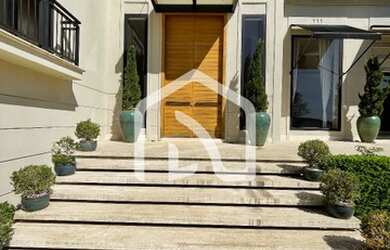 Imagem: A casa possui 4 Dormitórios, 5 Banheiros, 5 Vagas na garagem