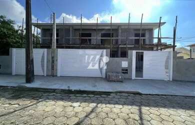 Imagem: A casa possui 3 Dormitórios, 3 Banheiros, 2 Vagas na garagem