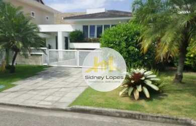 Imagem: A casa em condomínio possui 4 Dormitórios, 5 Banheiros, 600m²