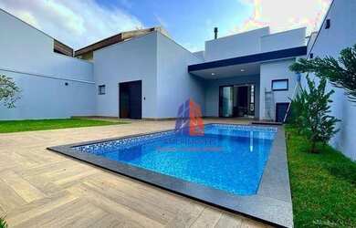 Imagem: A casa possui 3 Dormitórios, 5 Banheiros, 4 Vagas na garagem