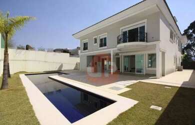 Imagem: A casa em condomínio possui 5 Dormitórios, 5 Banheiros, 4