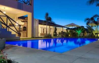 Imagem: A casa possui 5 Dormitórios, 5 Banheiros, 4 Vagas na garagem