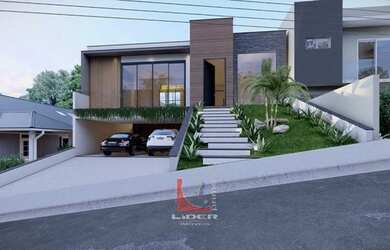 Imagem: A casa possui 3 Dormitórios, 5 Banheiros, 4 Vagas na garagem