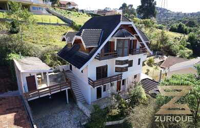 Imagem: A casa possui 5 Dormitórios, 5 Banheiros, 5 Vagas na garagem