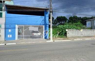 Imagem: A casa possui 3 Dormitórios, 3 Banheiros, 2 Vagas na garagem