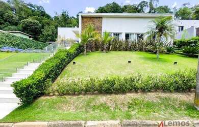 Imagem: A casa em condomínio possui 5 Dormitórios, 5 Banheiros, 4