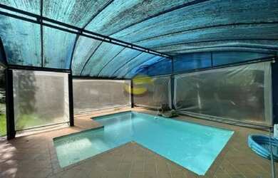 Imagem: A casa possui 5 Dormitórios, 5 Banheiros, 5 Vagas na garagem