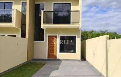 Imagem: A casa possui 2 Dormitórios, 3 Banheiros, 2 Vagas na garagem