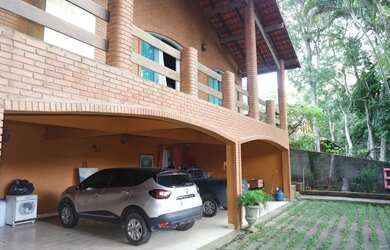 Imagem: A casa possui 5 Dormitórios, 5 Banheiros, 5 Vagas na garagem