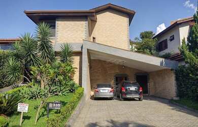 Imagem: A casa possui 4 Dormitórios, 5 Banheiros, 5 Vagas na garagem