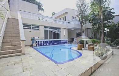 Imagem: A casa possui 5 Dormitórios, 5 Banheiros, 5 Vagas na garagem