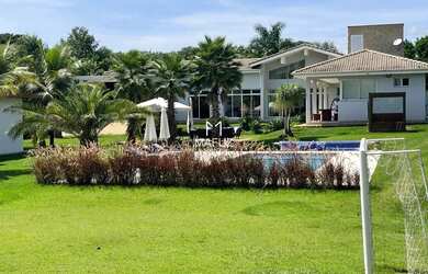 Imagem: A casa possui 5 Dormitórios, 5 Banheiros, 5 Vagas na garagem