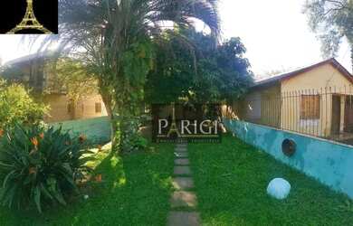 Imagem: A casa possui 4 Dormitórios, 2 Banheiros, 2 Vagas na garagem