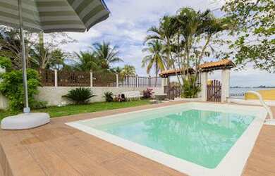 Imagem: A casa possui 3 Dormitórios, 3 Vagas na garagem e está localizado