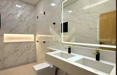 Imagem: A casa possui 3 Dormitórios, 4 Banheiros, 5 Vagas na garagem