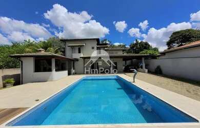 Imagem: A casa possui 4 Dormitórios, 5 Banheiros, 5 Vagas na garagem