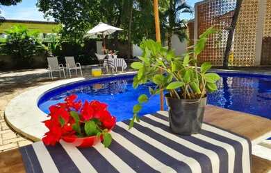 Imagem: A casa possui 5 Dormitórios e 4 Vagas na garagem e está localizado