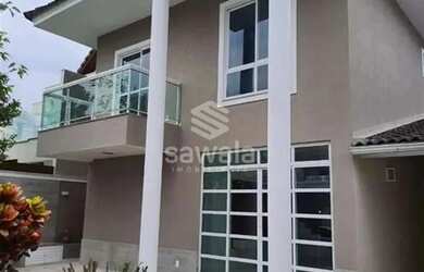 Imagem: A casa possui 4 Dormitórios, 5 Banheiros, 4 Vagas na garagem