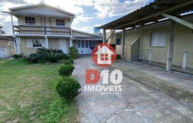 Imagem: A casa possui 3 Dormitórios, 2 Banheiros, 1 Vaga na garagem