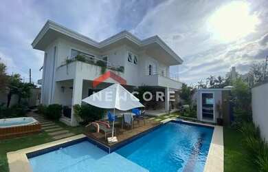 Imagem: A casa possui 5 Dormitórios, 5 Banheiros, 4 Vagas na garagem