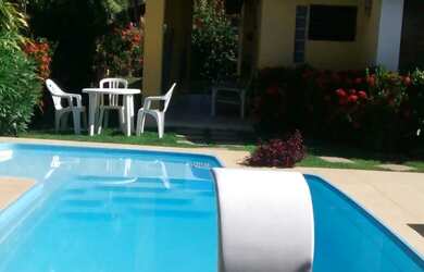 Imagem: A casa possui 4 Dormitórios, 4 Banheiros, 4 Vagas na garagem