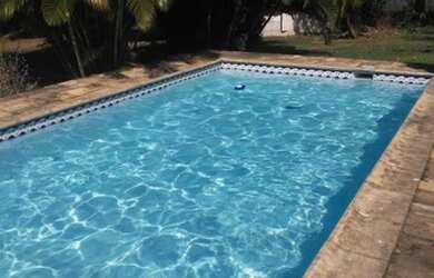 Imagem: A casa possui 2 Dormitórios, 4 Vagas na garagem e está localizado