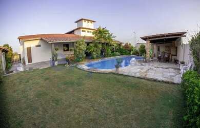 Imagem: A casa possui 5 Dormitórios, 5 Banheiros, 5 Vagas na garagem