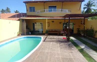 Imagem: A casa possui 4 Dormitórios, 2 Vagas na garagem e está localizado