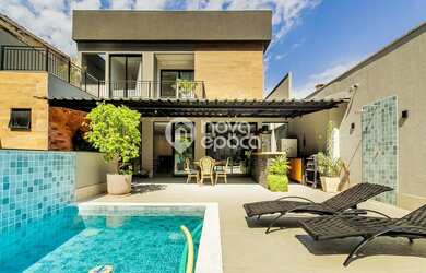 Imagem: A casa possui 4 Dormitórios, 5 Banheiros, 5 Vagas na garagem