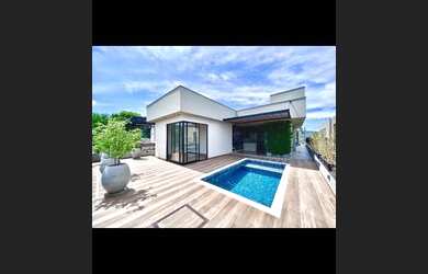 Imagem: A casa possui 3 Dormitórios, 5 Banheiros, 2 Vagas na garagem