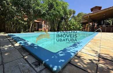 Imagem: A casa possui 3 Dormitórios, 3 Banheiros, 1 Vaga na garagem