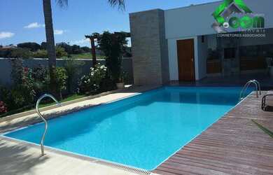 Imagem: A casa possui 4 Dormitórios, 4 Banheiros, 4 Vagas na garagem