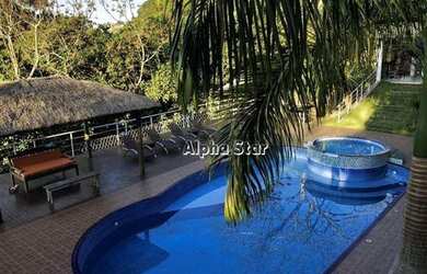 Imagem: A casa em condomínio possui 5 Dormitórios, 5 Banheiros, 5