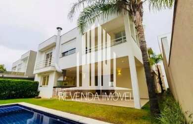 Imagem: A casa possui 4 Dormitórios, 5 Banheiros, 5 Vagas na garagem