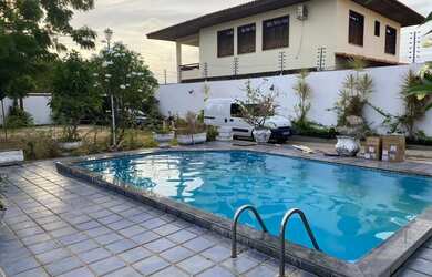 Imagem: A casa possui 3 Dormitórios, 4 Banheiros, 4 Vagas na garagem