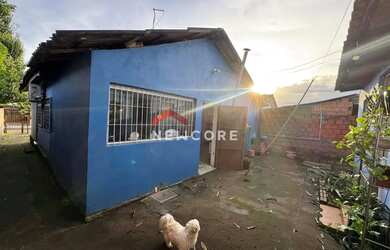Imagem: A casa possui 3 Dormitórios, 1 Banheiro, 1 Vaga na garagem